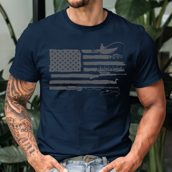 Man wearing a navy blue t-shirt with a graphic design, standing outdoors.