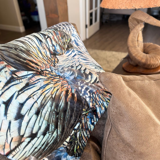 Turkey Feather Pattern Throw Blanket from River to Ridge Brand, on the couch