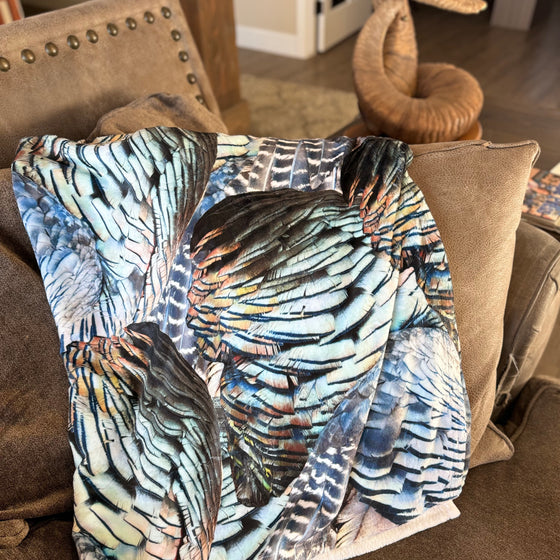 Turkey Feather Pattern Throw Blanket from River to Ridge Brand, on the couch
