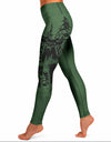 Green leggings with a nature-themed design on a white background