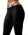Black leggings with a patterned waistband on a white background