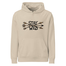  Product mockup of a River to Ridge Clothing Brand hoodie with the Stay Wild Archery Bowhunting Logo on it with traditional african arrows