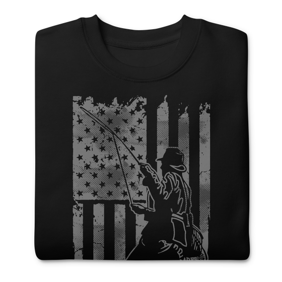Men's Fishing USA logo on a black sweatshirt from the Brand River to Ridge Clothing, featuring a man fly fishing in a river with the USA American flag in the background