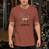 Man wearing a brown t-shirt with a graphic design in a gym setting