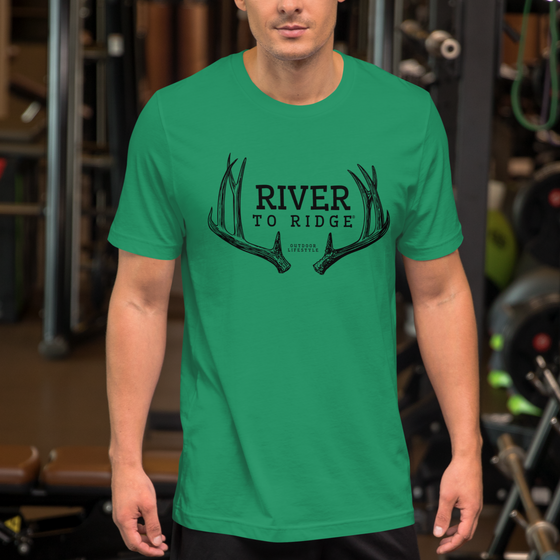 River to Ridge Clothing Brand Mule Deer Antler Logo T shirt for Men in green - photo of a man at the gym wearing the tee shirt