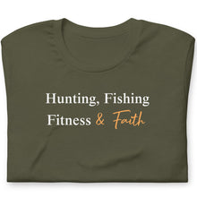  Folded green t-shirt with text 'Hunting, Fishing, Fitness & Faith' on a white background