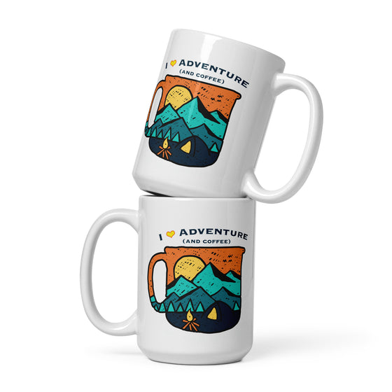 2 coffee mugs with I love adventure and coffee logo, mountains, campfire and a tent