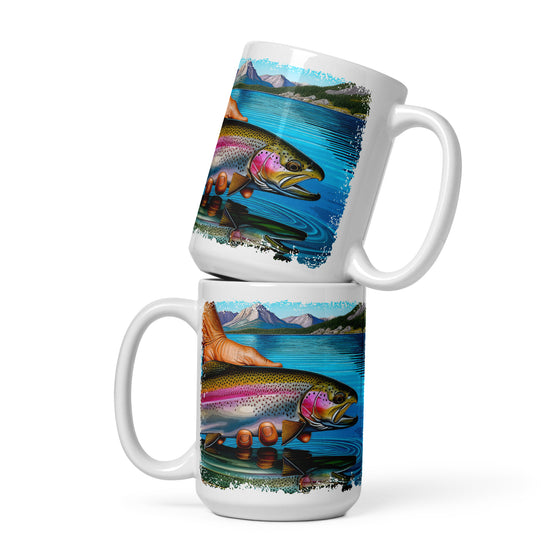 Product mockup of a River to Ridge Clothing Brand Trout Fishing large coffee mug with a rainbow trout being held above the river in bright colors