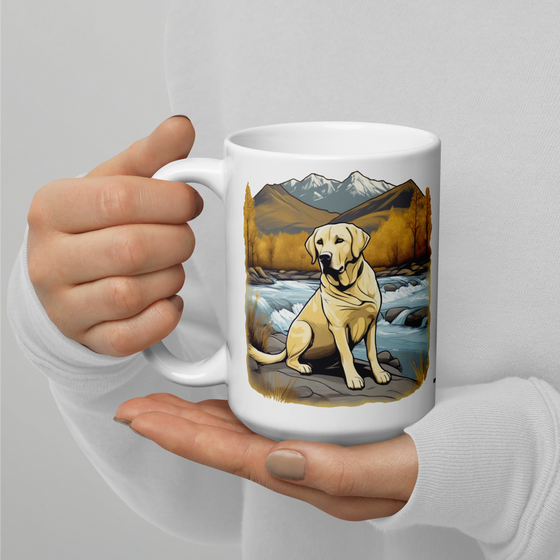 Product mockup of a River to Ridge Clothing Brand Yellow Lab Coffee Mug with a dog sitting by a river and mountains in the background