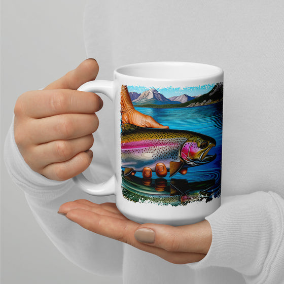 Product mockup of a River to Ridge Clothing Brand Trout Fishing large coffee mug with a rainbow trout being held above the river in bright colors