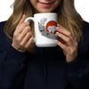 Woman holding a mug with a design on a white background