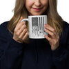 Woman holding a mug with an American flag design on a white background