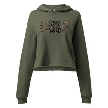  Product mockup of a River to Ridge cropped womens hoodie with the Stay Wild Archery Bowhunting Logo on it with traditional african arrows
