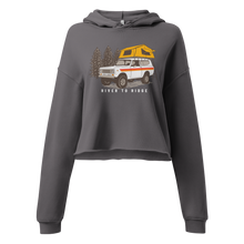  Vintage Truck Camping Logo with a Scout and a tent on top on a cropped hoodie from River to Ridge Brand for women