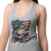 Woman wearing a gray tank top with a fish and American flag design on a white background