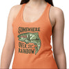 Woman wearing an orange tank top with a graphic design and text on a white background